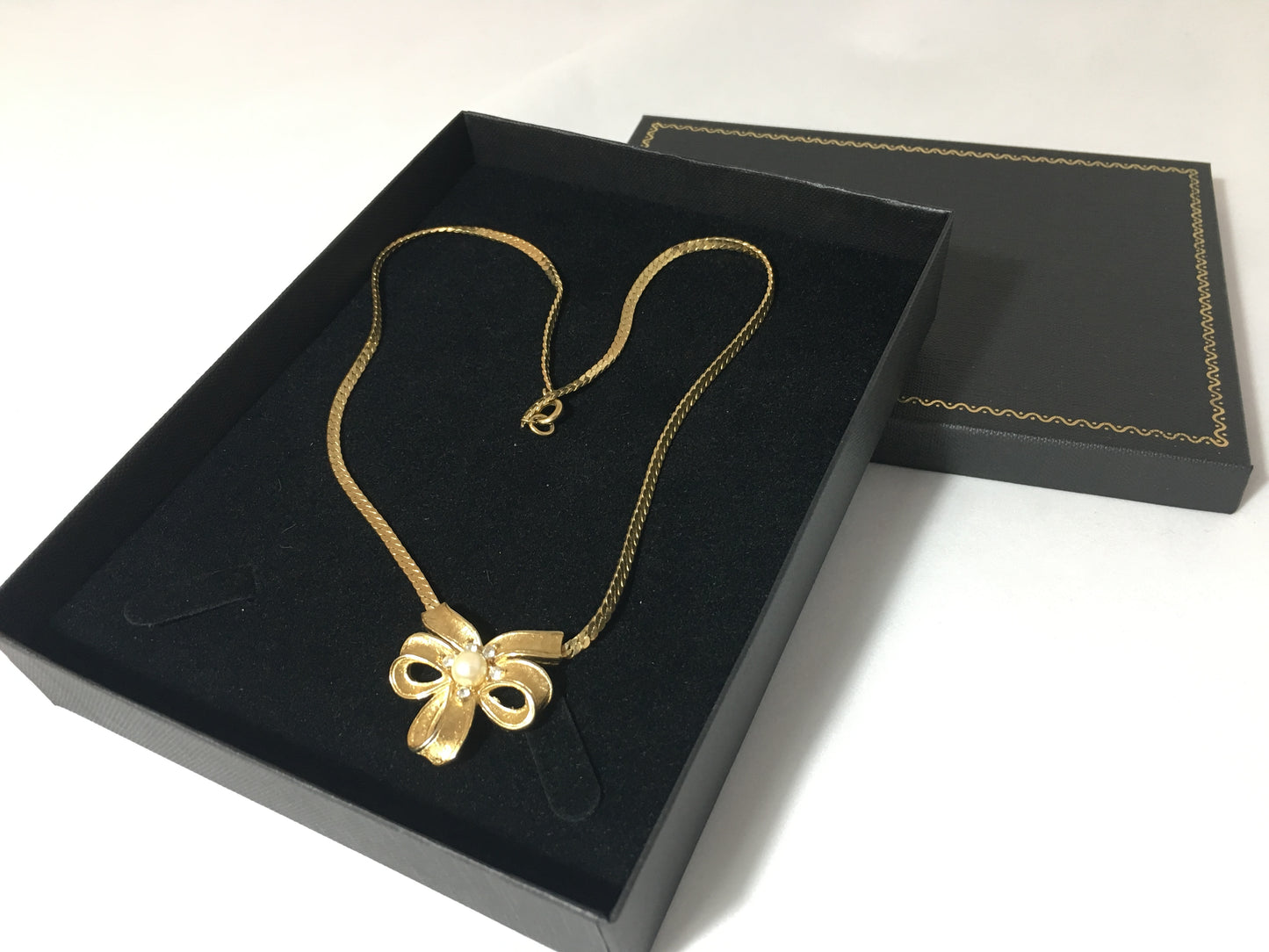 Vintage TRIFARI Gold-Tone Necklace with Triple-Loop Bow Pendant - Busy Bowerbird