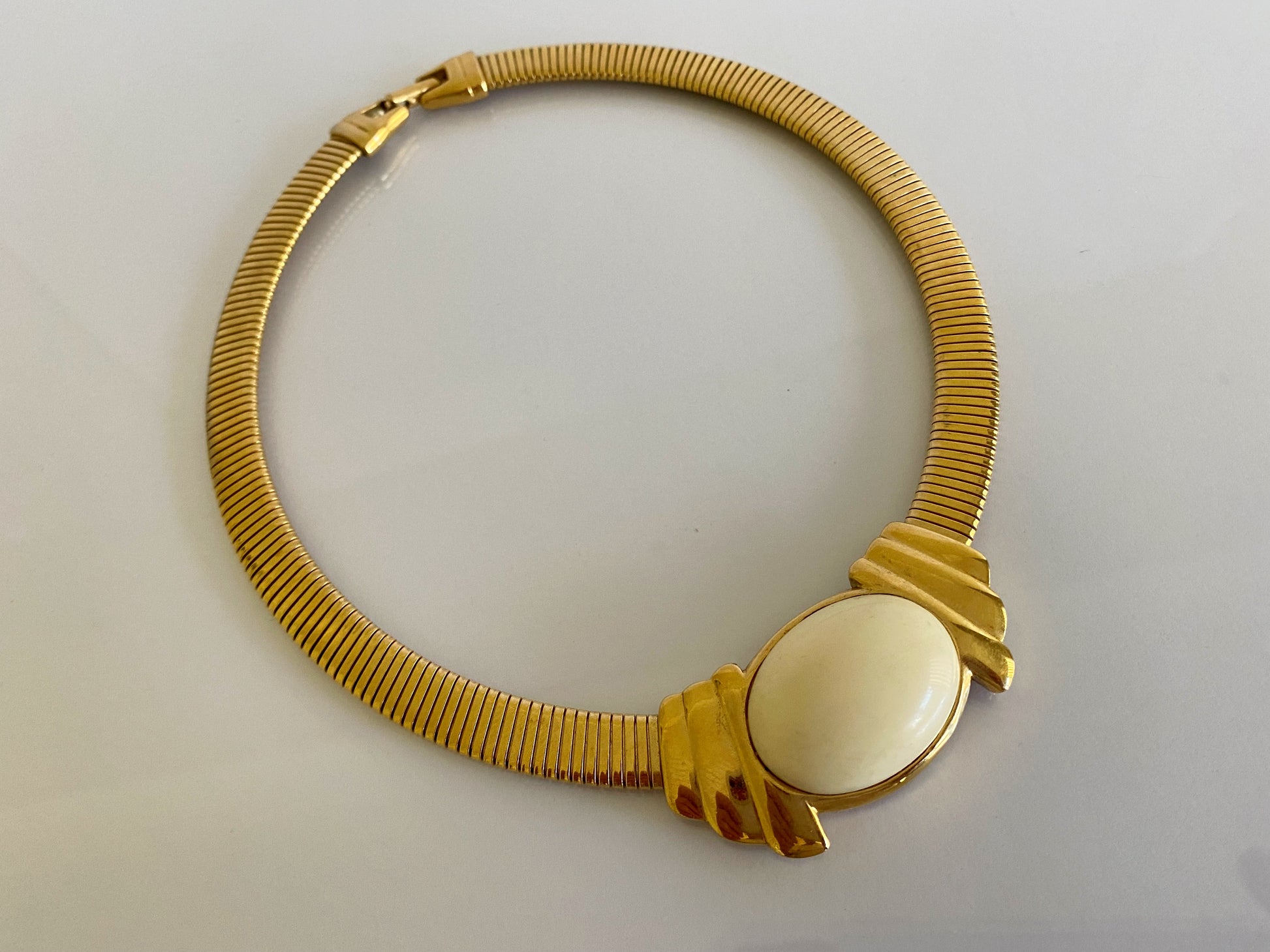 Vintage TRIFARI Gold-Plated Omega Necklace with White Cabochon - Busy Bowerbird