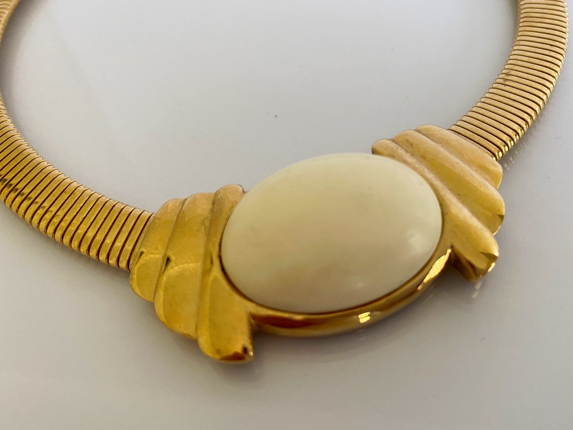Vintage TRIFARI Gold-Plated Omega Necklace with White Cabochon - Busy Bowerbird