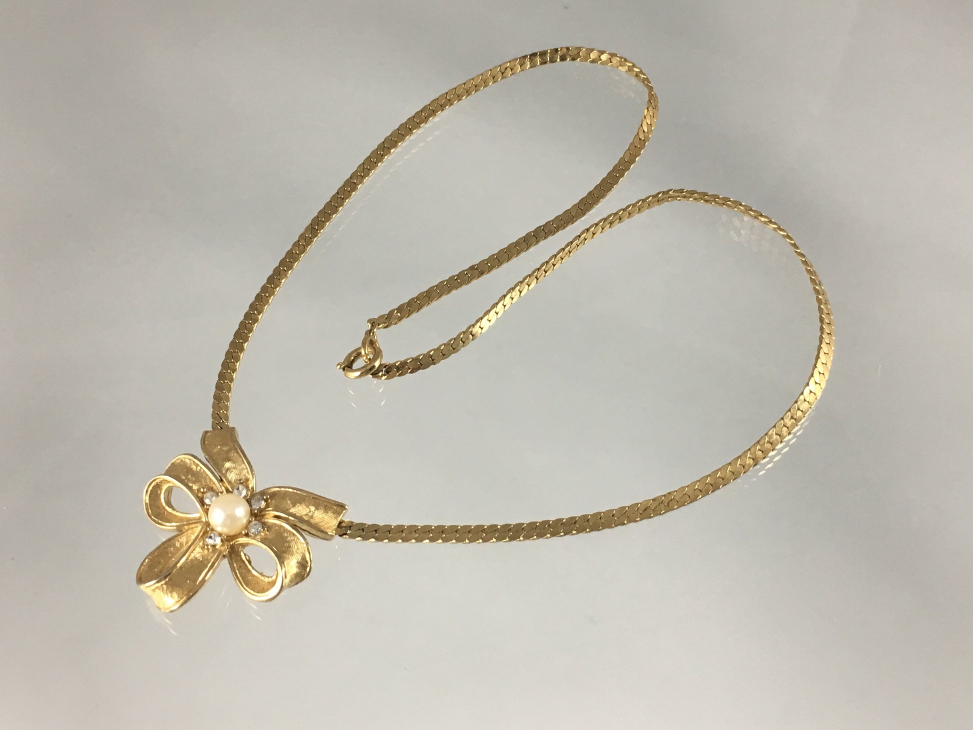 Vintage TRIFARI Gold-Tone Necklace with Triple-Loop Bow Pendant - Busy Bowerbird