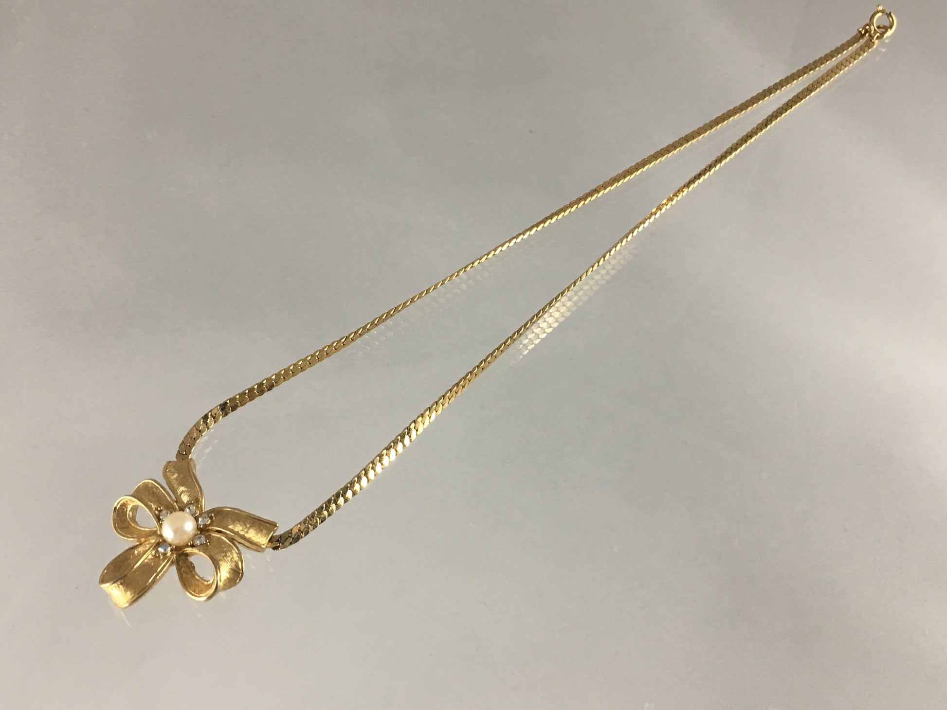Vintage TRIFARI Gold-Tone Necklace with Triple-Loop Bow Pendant - Busy Bowerbird