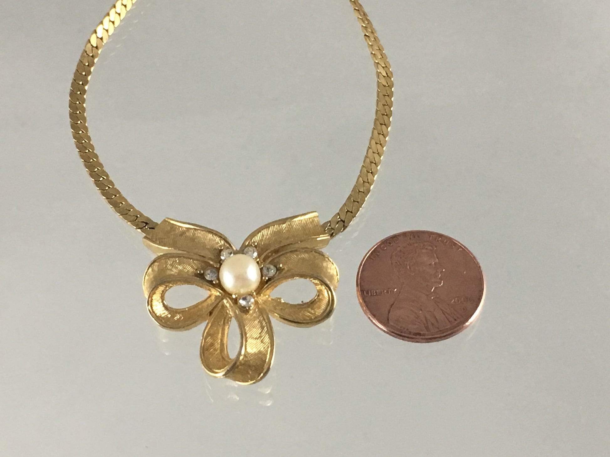 Vintage TRIFARI Gold-Tone Necklace with Triple-Loop Bow Pendant - Busy Bowerbird