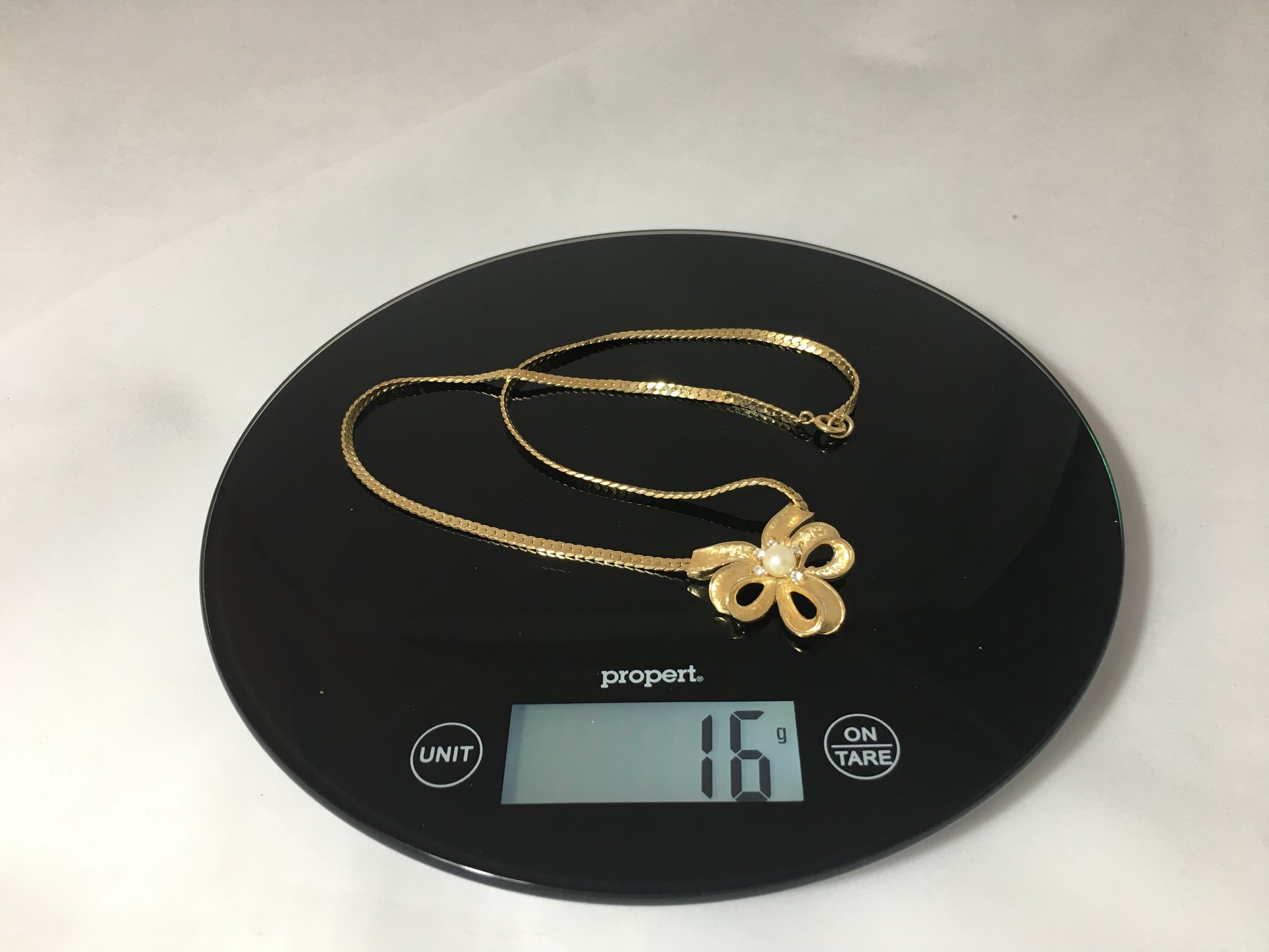 Vintage TRIFARI Gold-Tone Necklace with Triple-Loop Bow Pendant - Busy Bowerbird