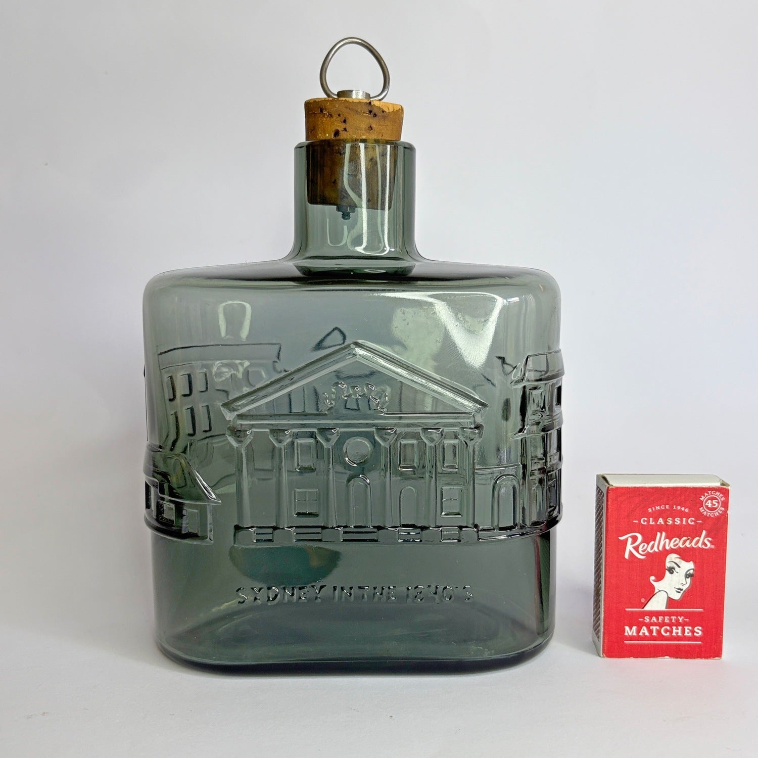 Nuutajärvi Notsjö decanter with matchbox for scale — mid-century Finnish pressed glass