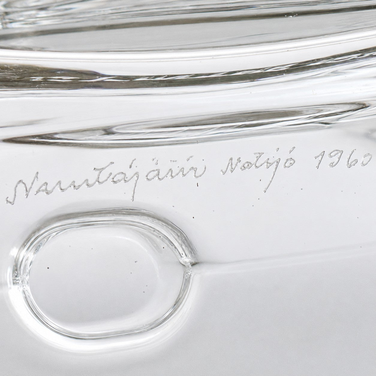 Close crop of handwritten signature and date marks inside base of Nuutajärvi decanter
